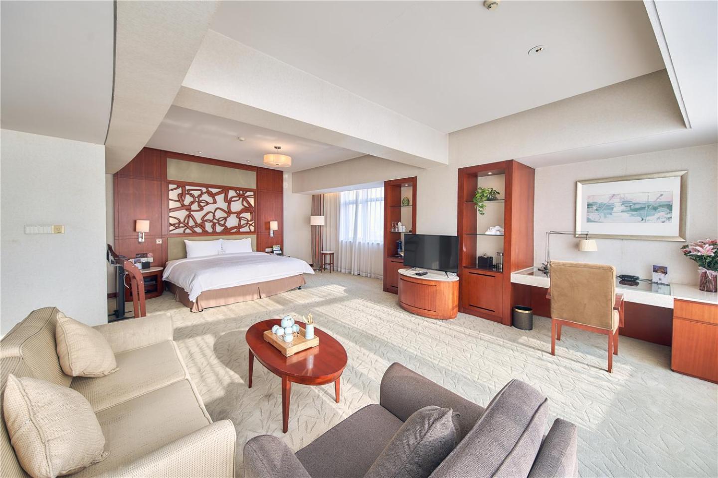 Habitación doble deluxe con cama grande y vistas al parque