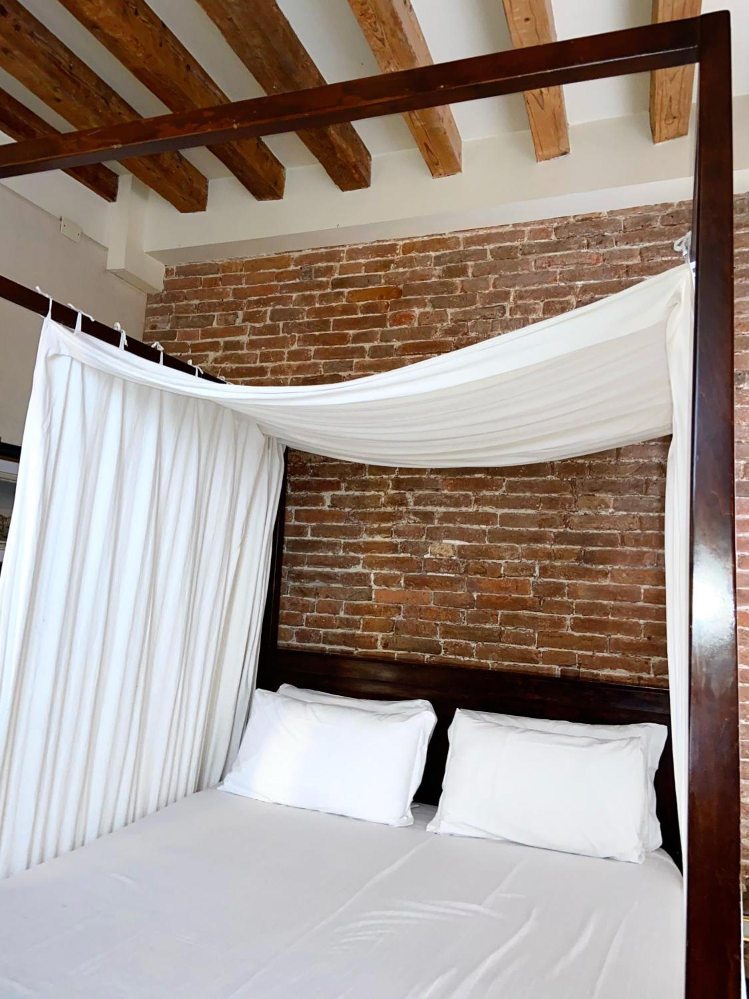 Habitación Doble Superior con cama con dosel