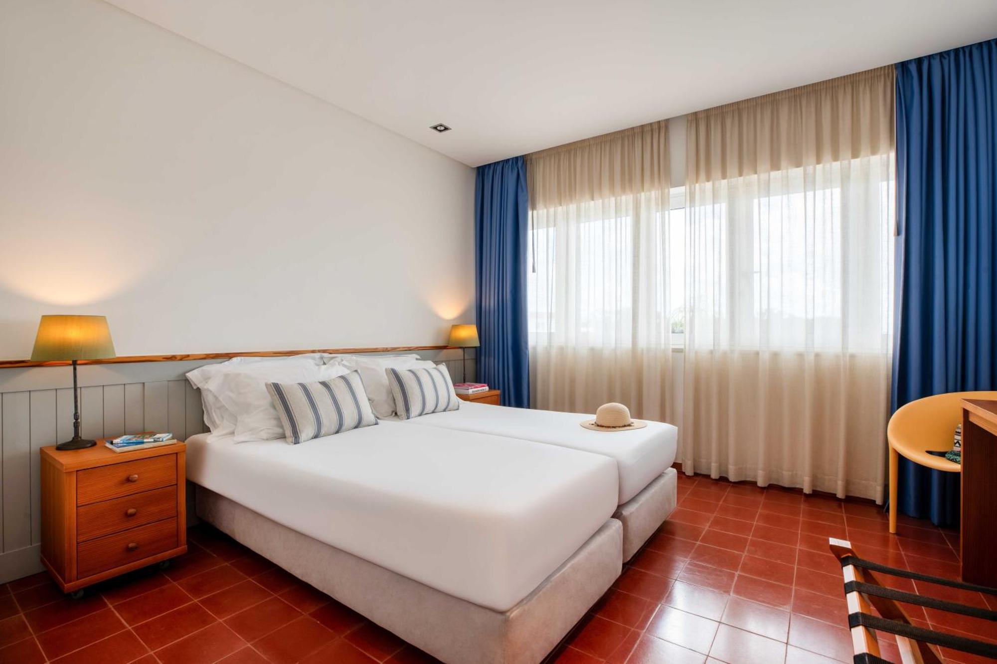 Three-Bedroom Apartment with Balcony and Pool View