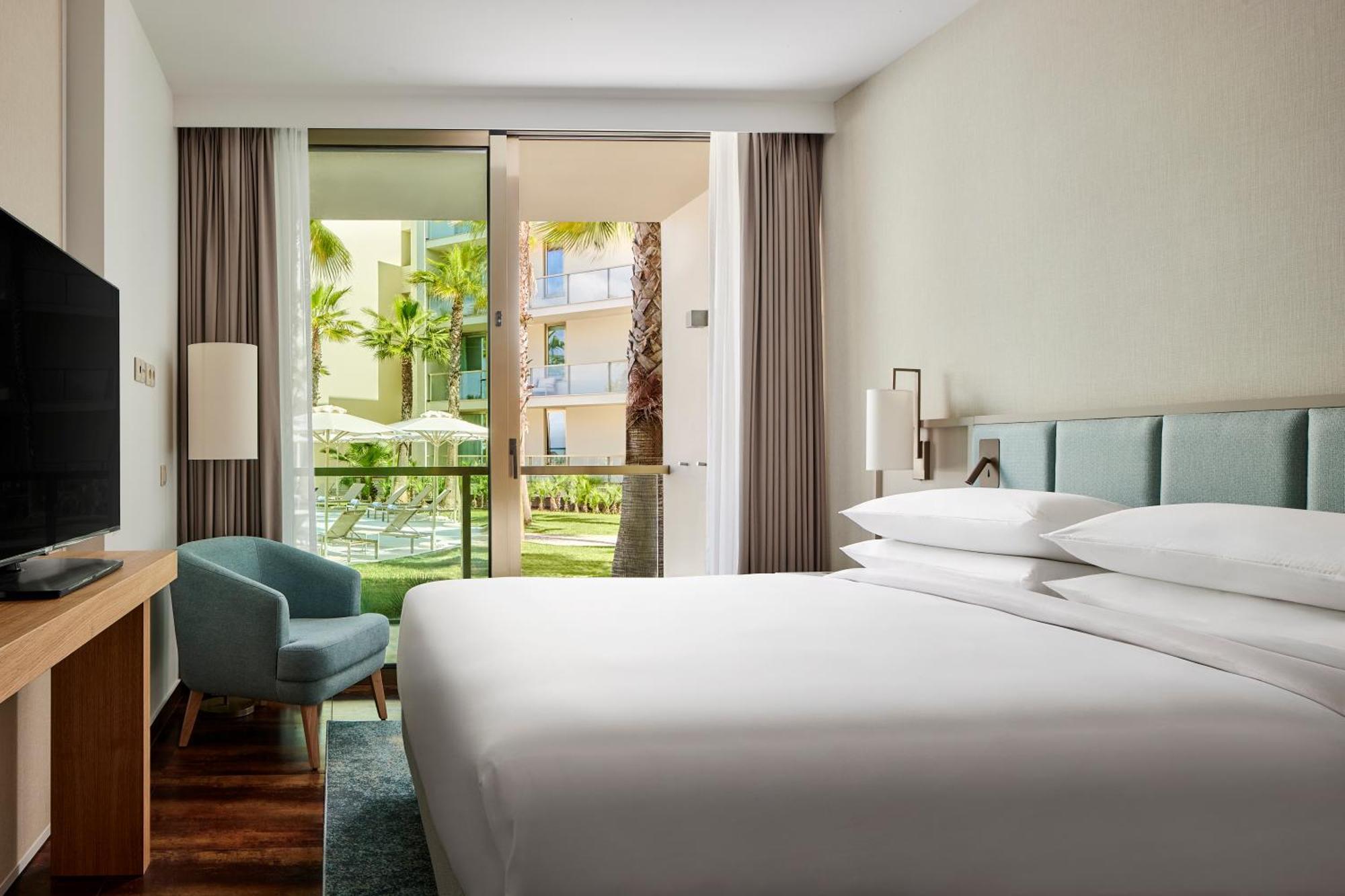 One-Bedroom King Suite Balcony Pool View