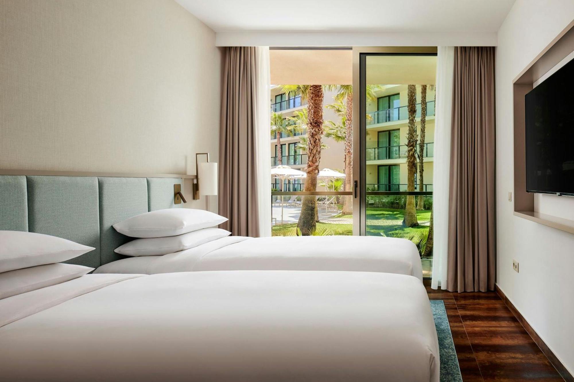 Two-Bedroom Suite Balcony Pool View