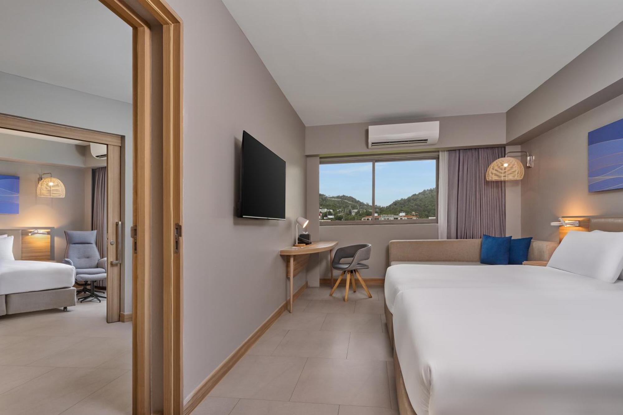 Two-Bedroom Suite with One Double and Two Single Beds,1731516739:JPEG
