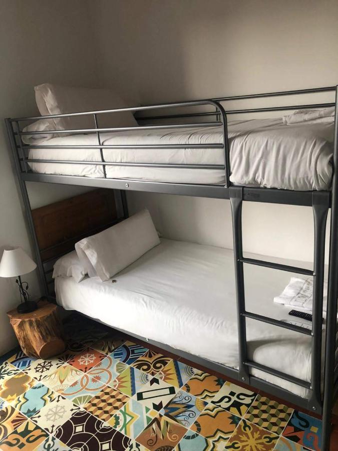 Habitación Doble con litera y baño privado externo