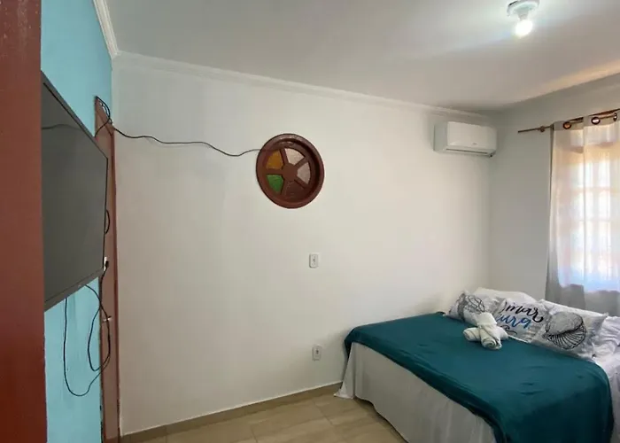 Suites e Quartos Em frente a Praia Grande -Na orla Flavia Alessandra