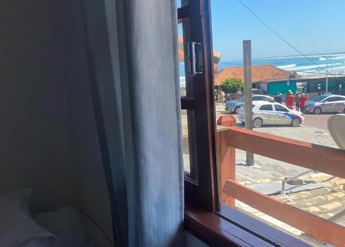 Suites e Quartos Em frente a Praia Grande -Na orla Flavia Alessandra